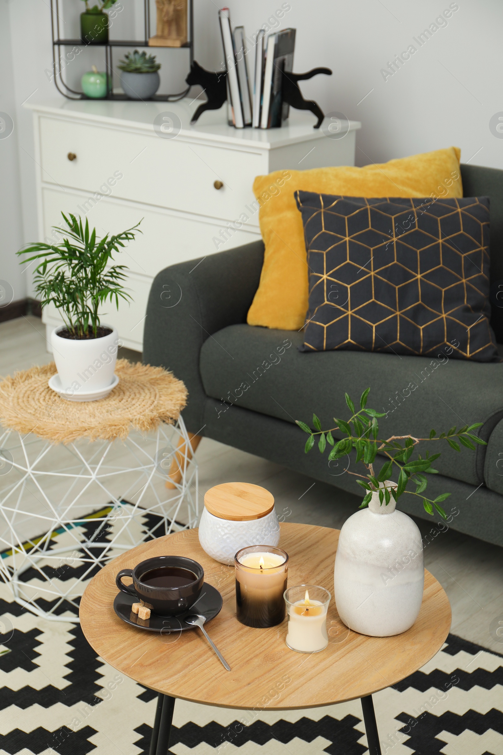 Photo of Living room interior with comfortable furniture and decorative elements