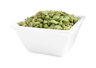 Ceramic bowl with dry cardamom isolated on white