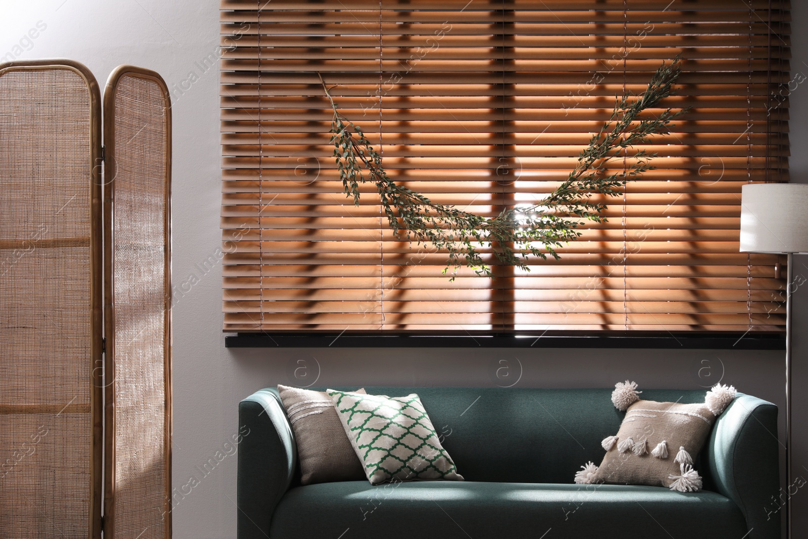 Photo of Stylish room decorated with beautiful eucalyptus garland