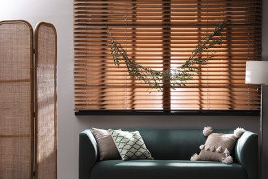 Photo of Stylish room decorated with beautiful eucalyptus garland