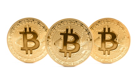 Photo of Gold bitcoins isolated on white. Digital currency