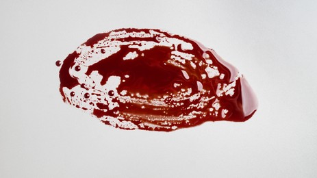 Photo of Stainblood on grey background, top view