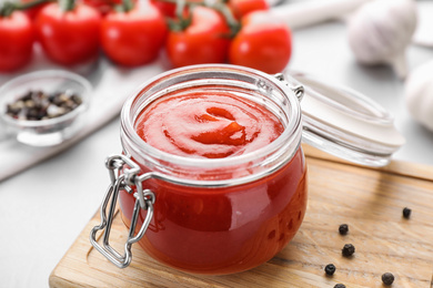 Delicious fresh tomato sauce on table, closeup