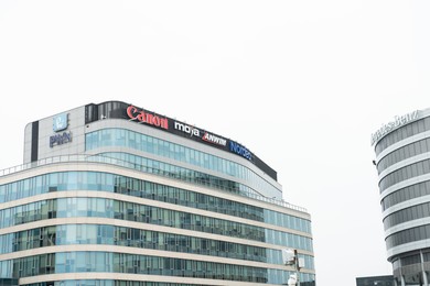 Photo of Warsaw, Poland - September 10, 2022: Buildings with many modern logos
