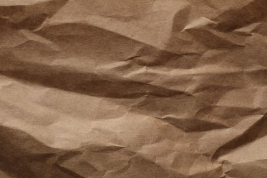 Photo of Crumpled sheet of paper as background, top view