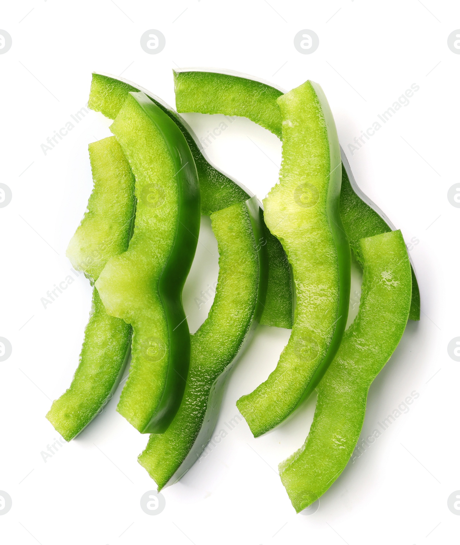 Photo of Pile of green bell pepper slices on white background, top view