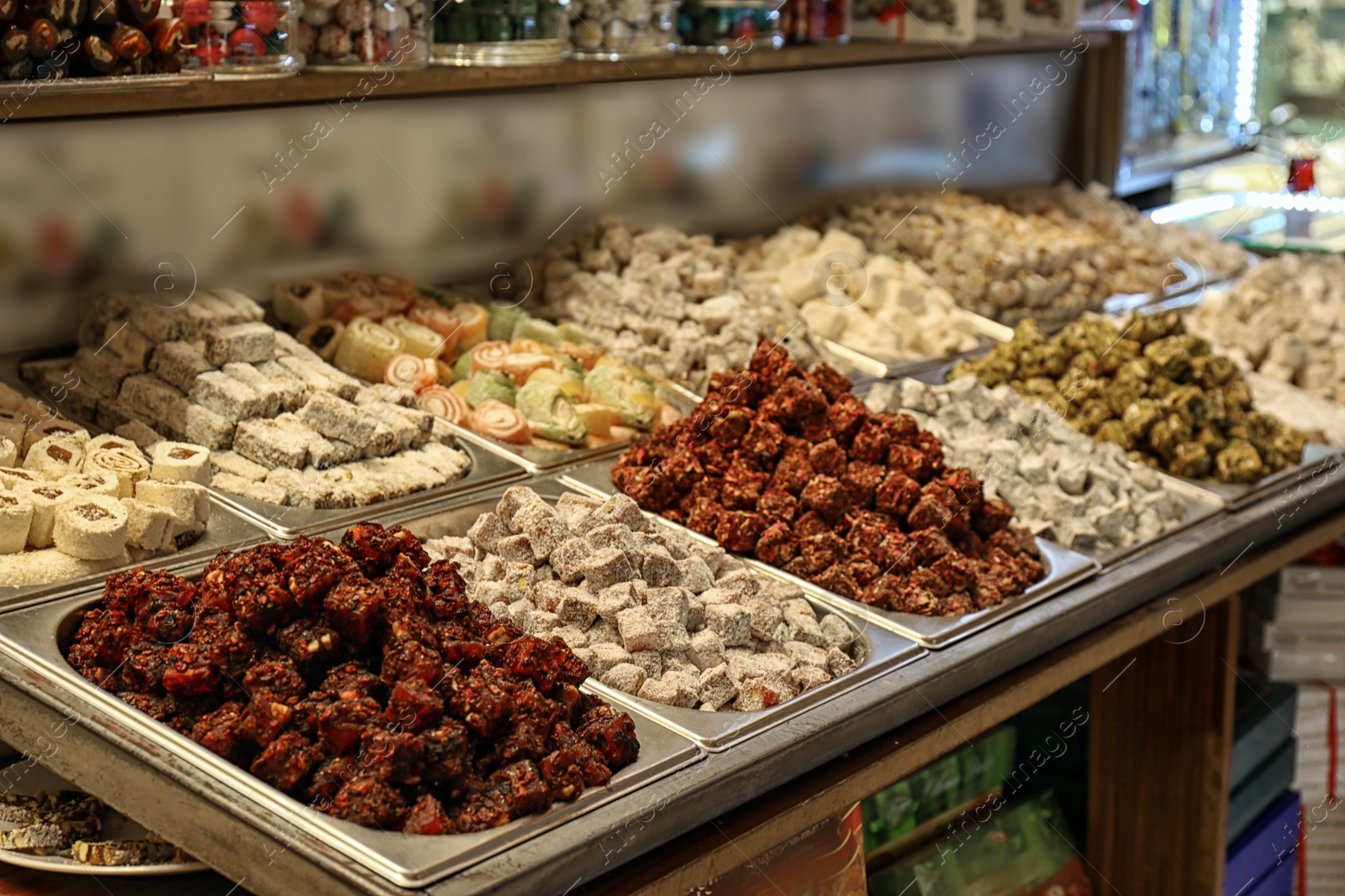 Photo of Different kinds of delicious sweets at market