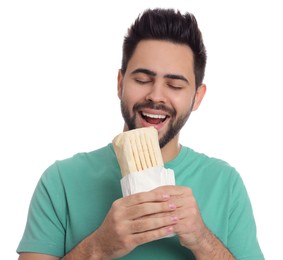 Photo of Young man eating tasty shawarma isolated on white