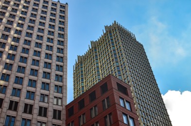 Photo of Exterior of beautiful buildings against blue sky, low angle view