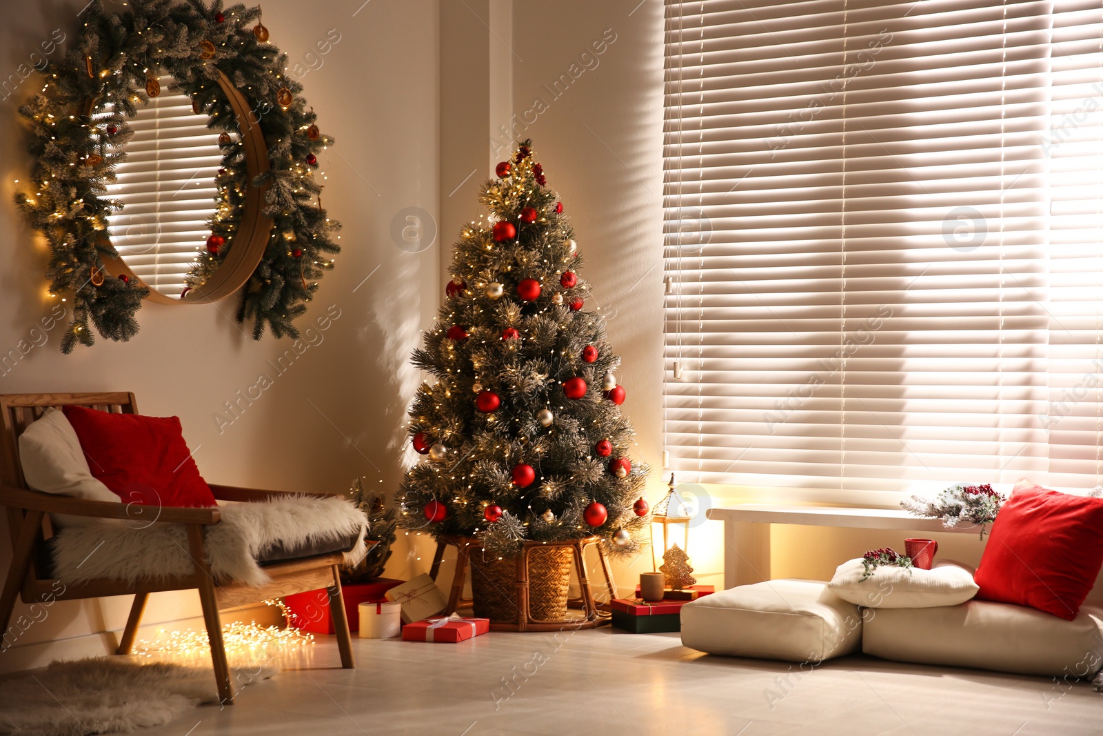 Photo of Beautiful decorated Christmas tree in festive room interior