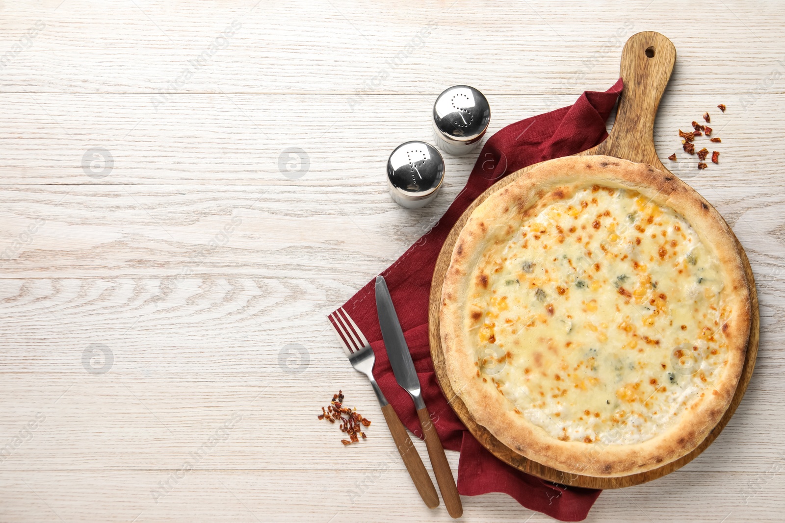 Photo of Delicious cheese pizza served on white wooden table, flat lay. Space for text