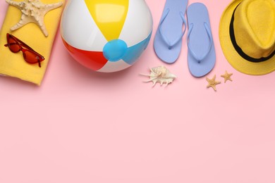 Photo of Flat lay composition with beach ball on pink background. Space for text