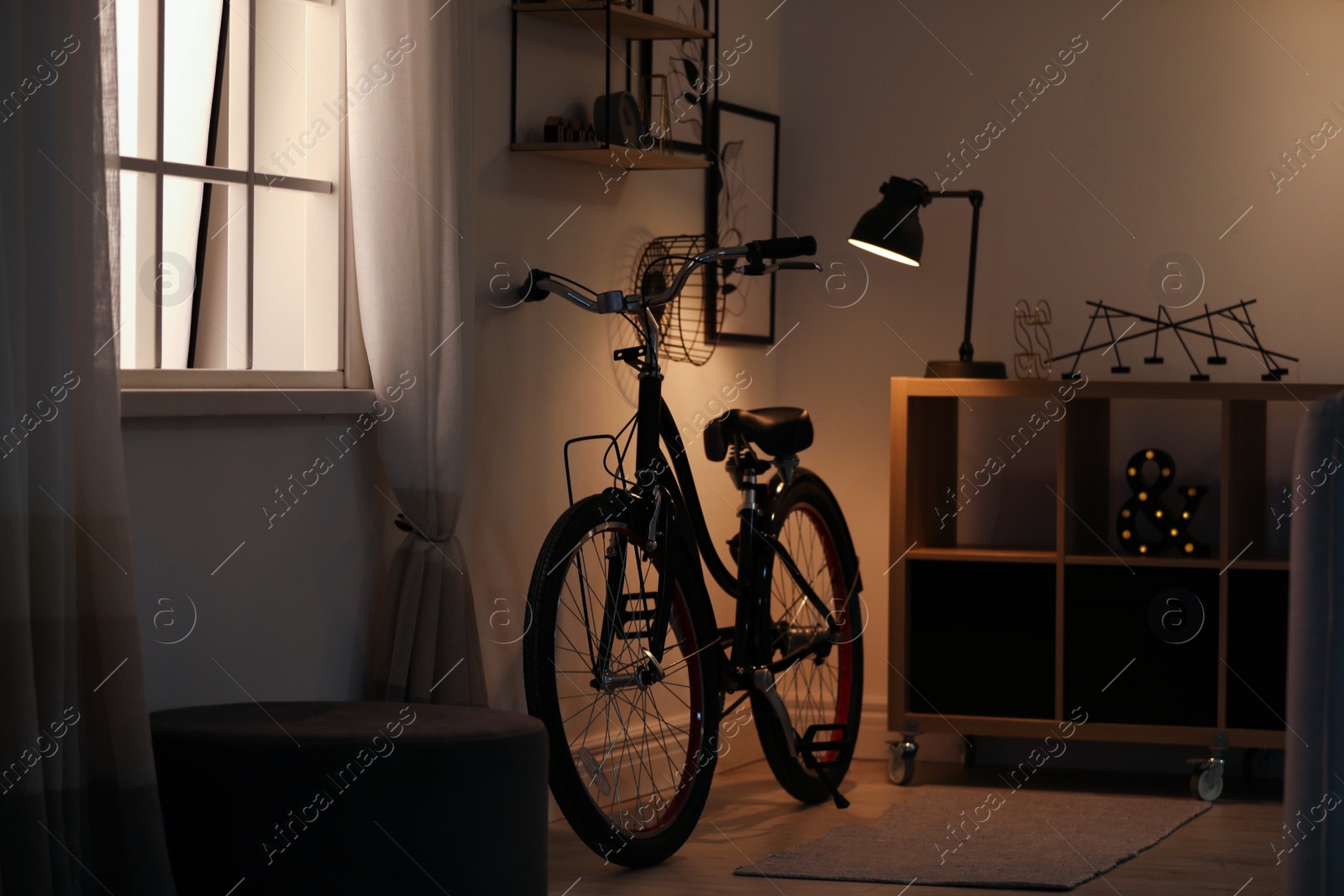 Photo of Stylish room with modern bicycle. Idea for interior decor