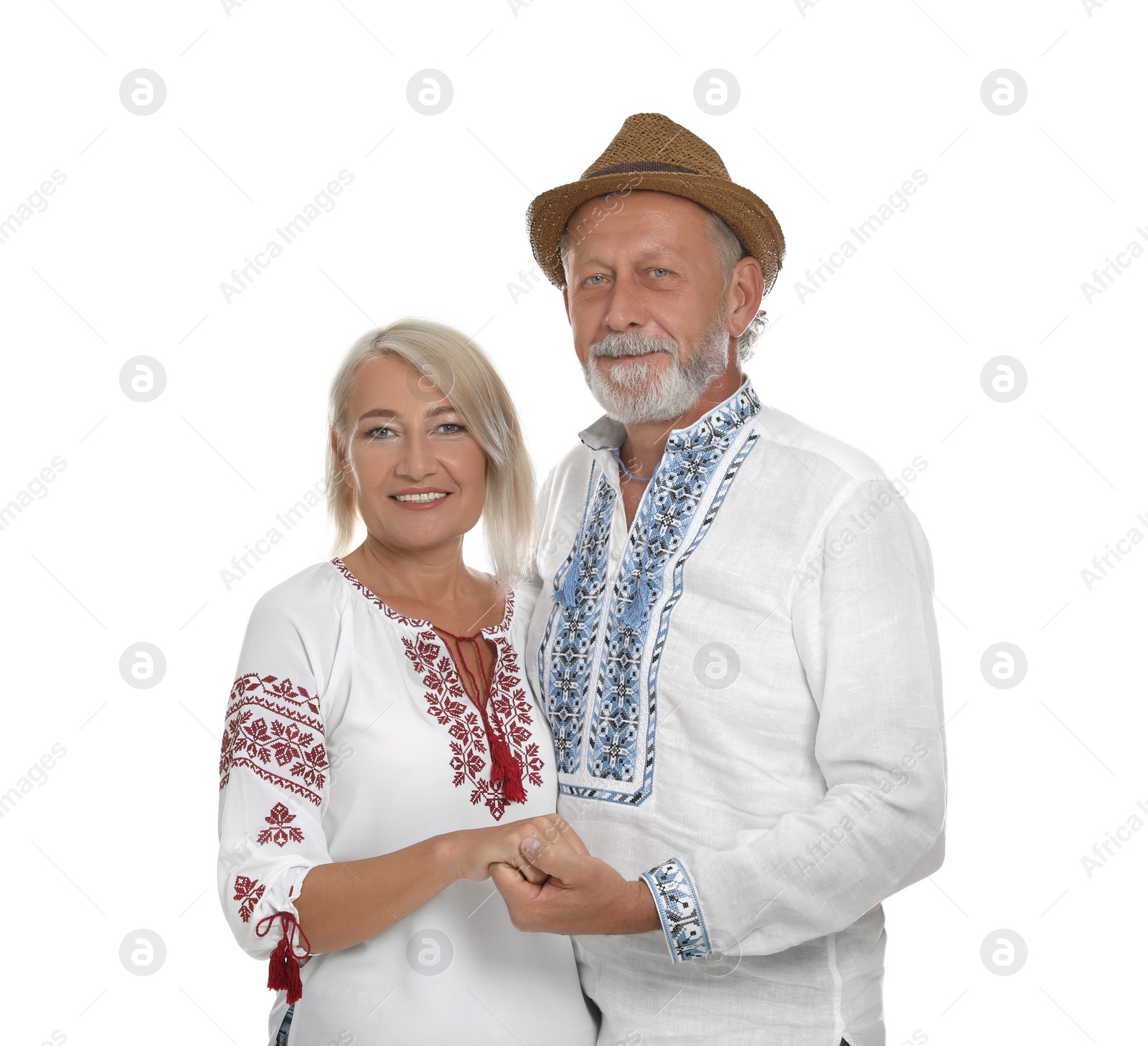 Photo of Happy mature couple in Ukrainian national clothes on white background