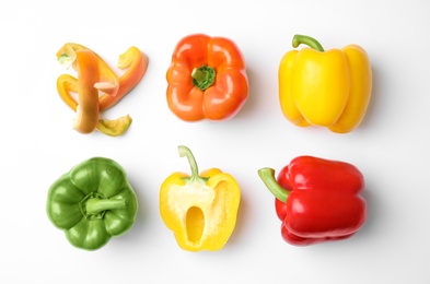 Photo of Flat lay composition with raw ripe paprika peppers on white background