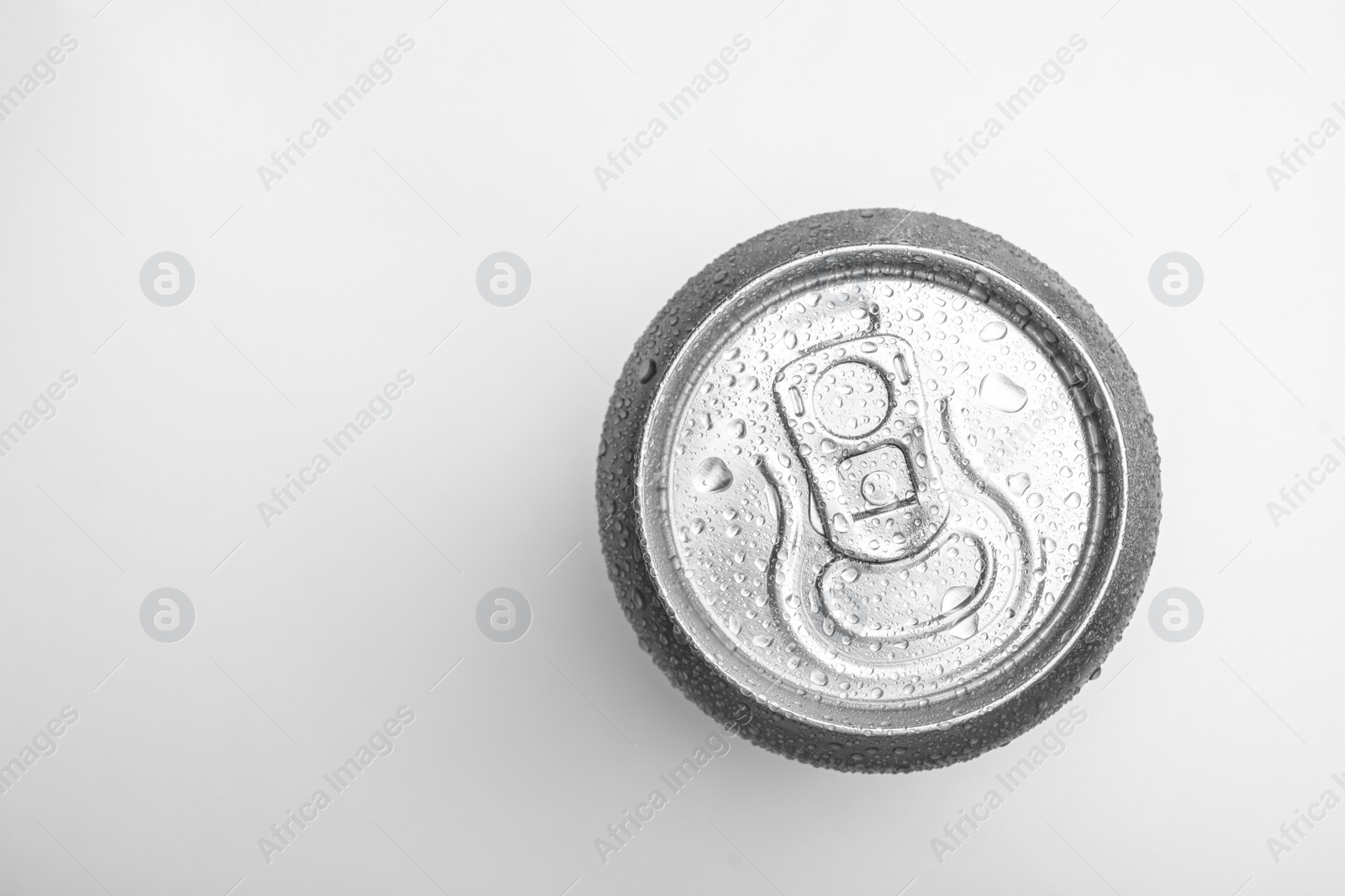 Photo of Wet closed can on white background, top view