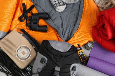 Photo of Composition with sleeping bags and camping equipment as background