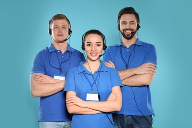 Group of technical support operators on color background