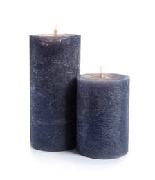 Two decorative wax candles on white background