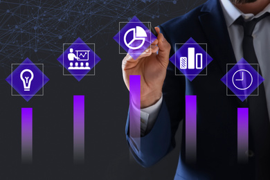 Image of Businessman using virtual screen with business analytics information, closeup