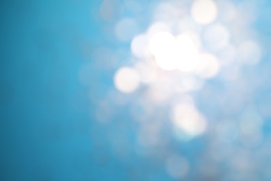 Photo of Shiny turquoise background with magical bokeh effect