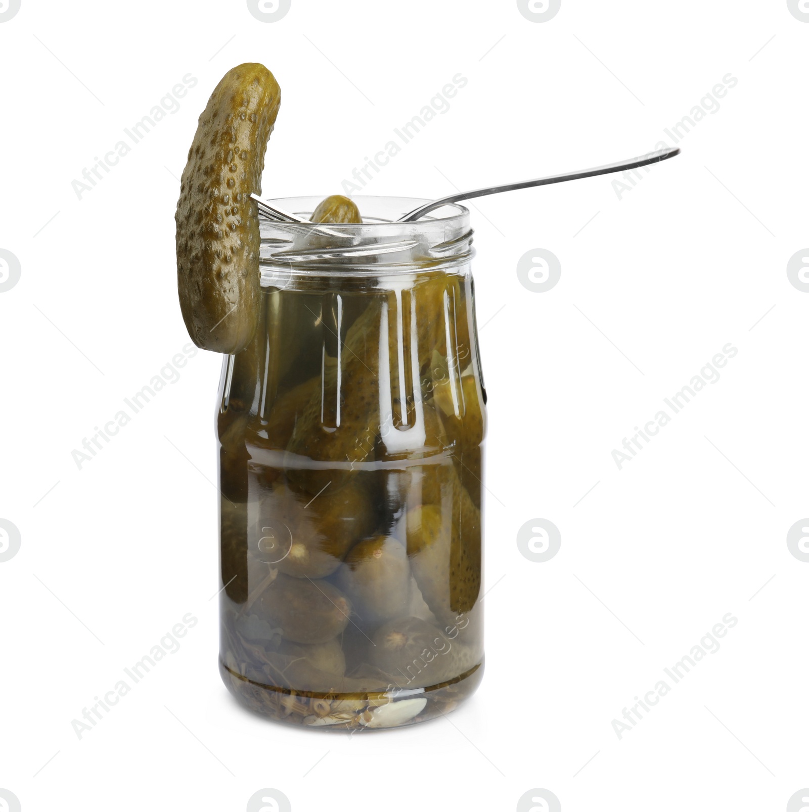 Photo of Fork with marinated cucumber over jar on white background