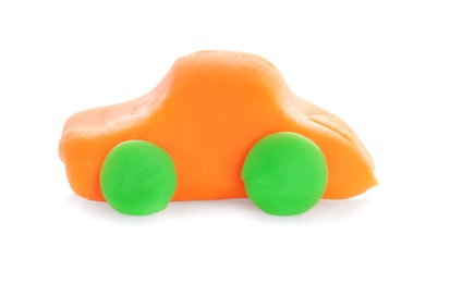Photo of Small car made from play dough on white background