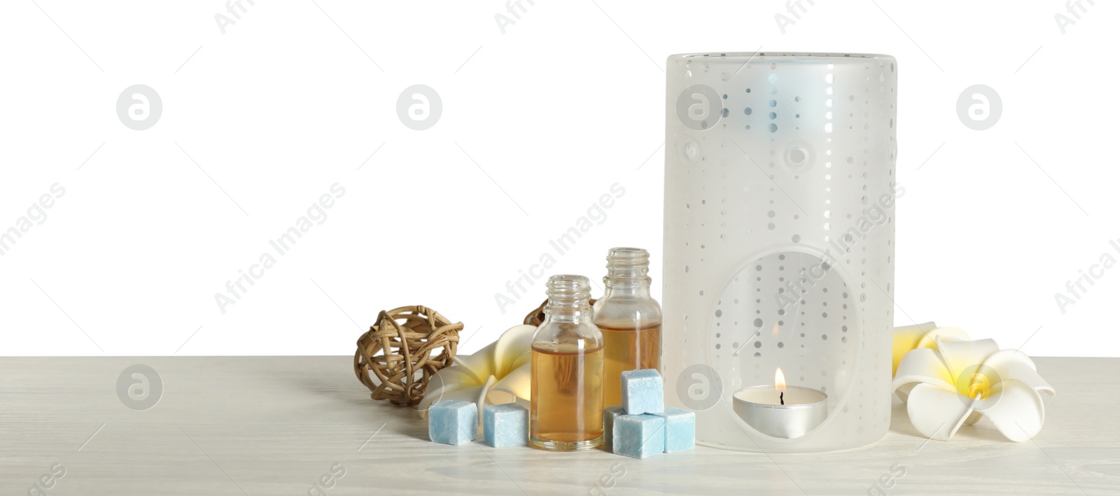 Photo of Composition with aroma lamp on white table against light grey background, space for text