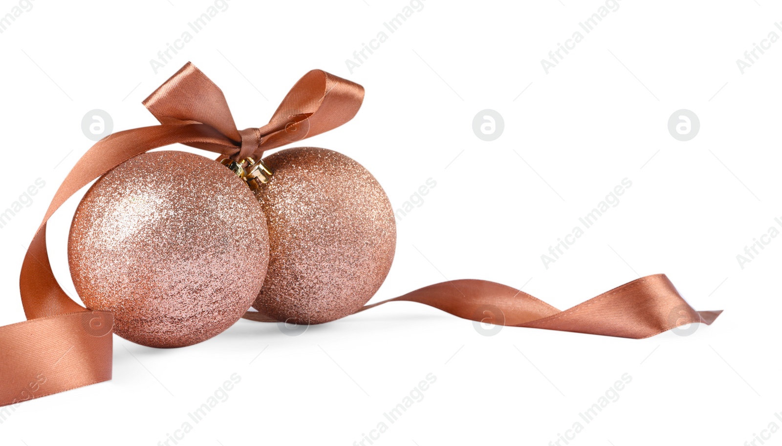 Photo of Beautiful coral Christmas balls with ribbon isolated on white