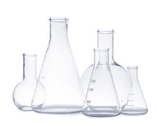 Set of empty laboratory glassware on white background