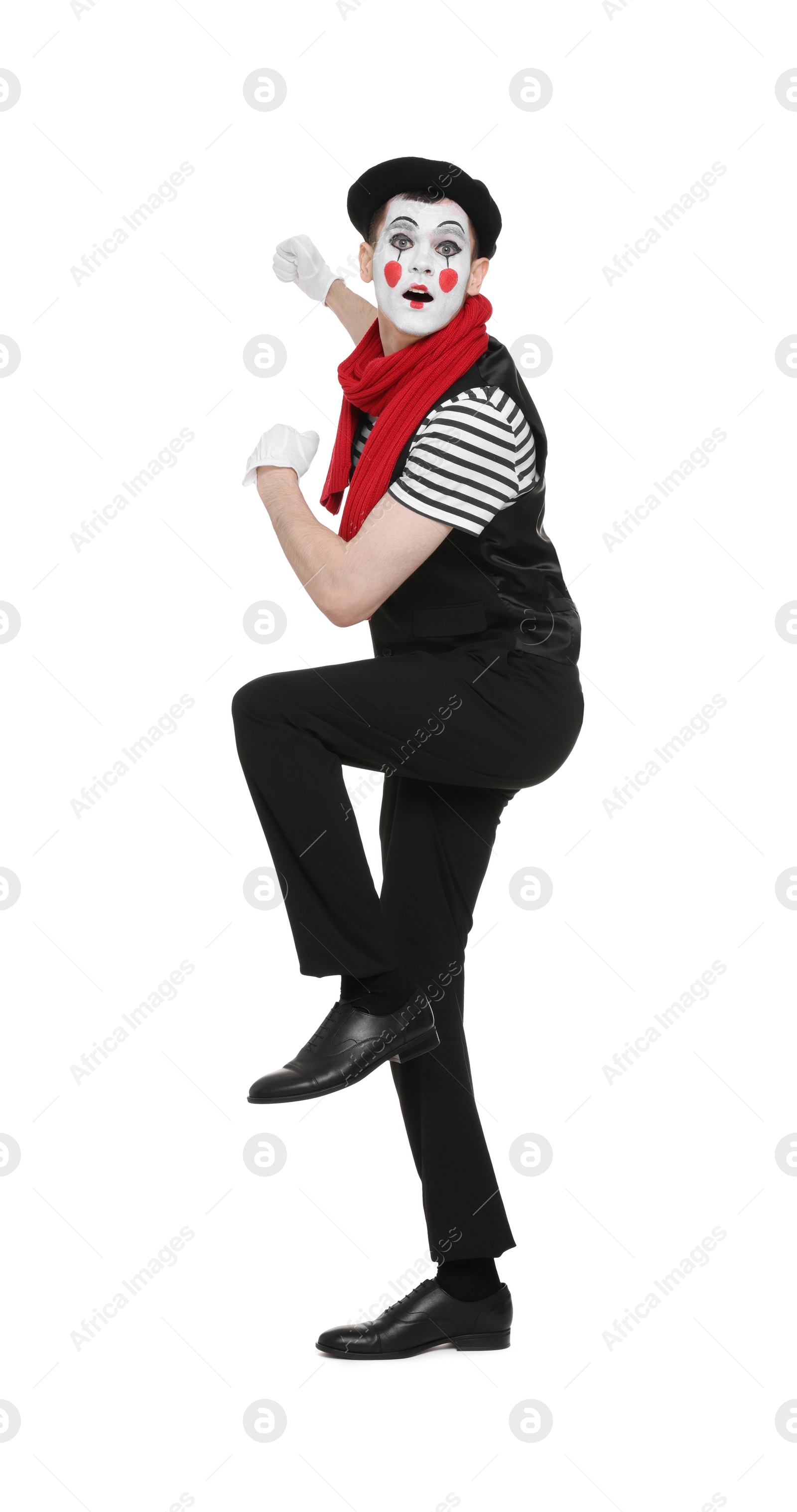 Photo of Funny mime artist in beret posing on white background