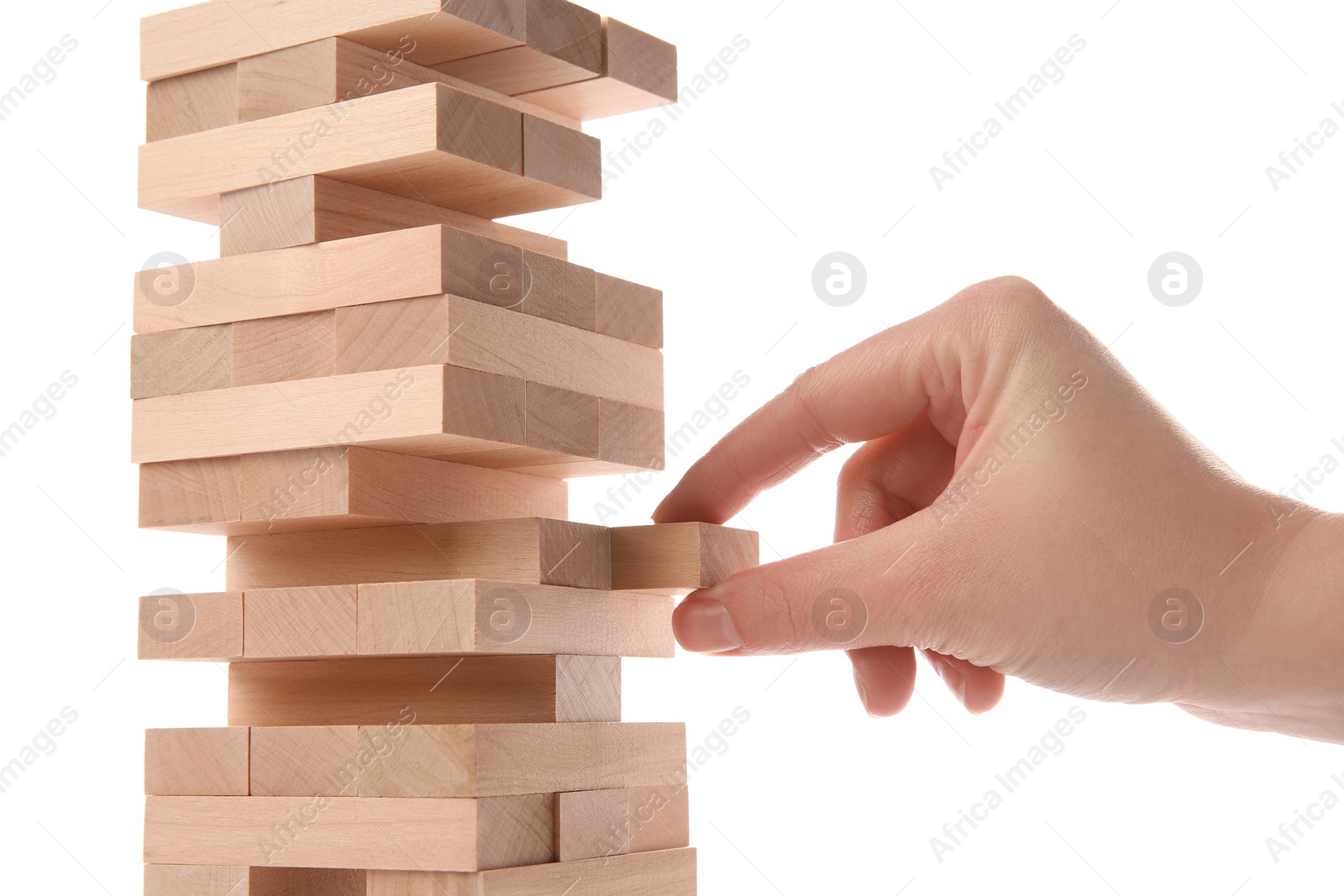 Photo of Woman playing Jenga on white background, closeup