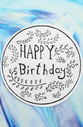 Photo of Card with words HAPPY BIRTHDAY and floral pattern on color background, top view