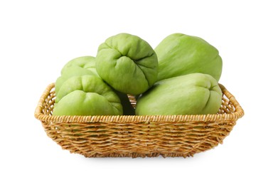 Photo of Fresh green chayote in wicker basket isolated on white