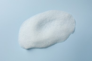 Foam sample on light blue background, top view