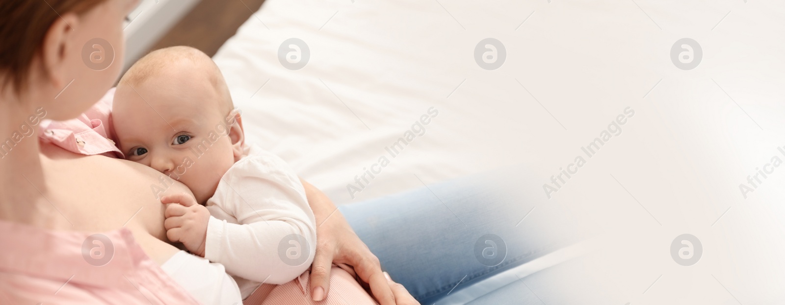 Image of Young woman breast feeding her little baby, space for text. Banner design