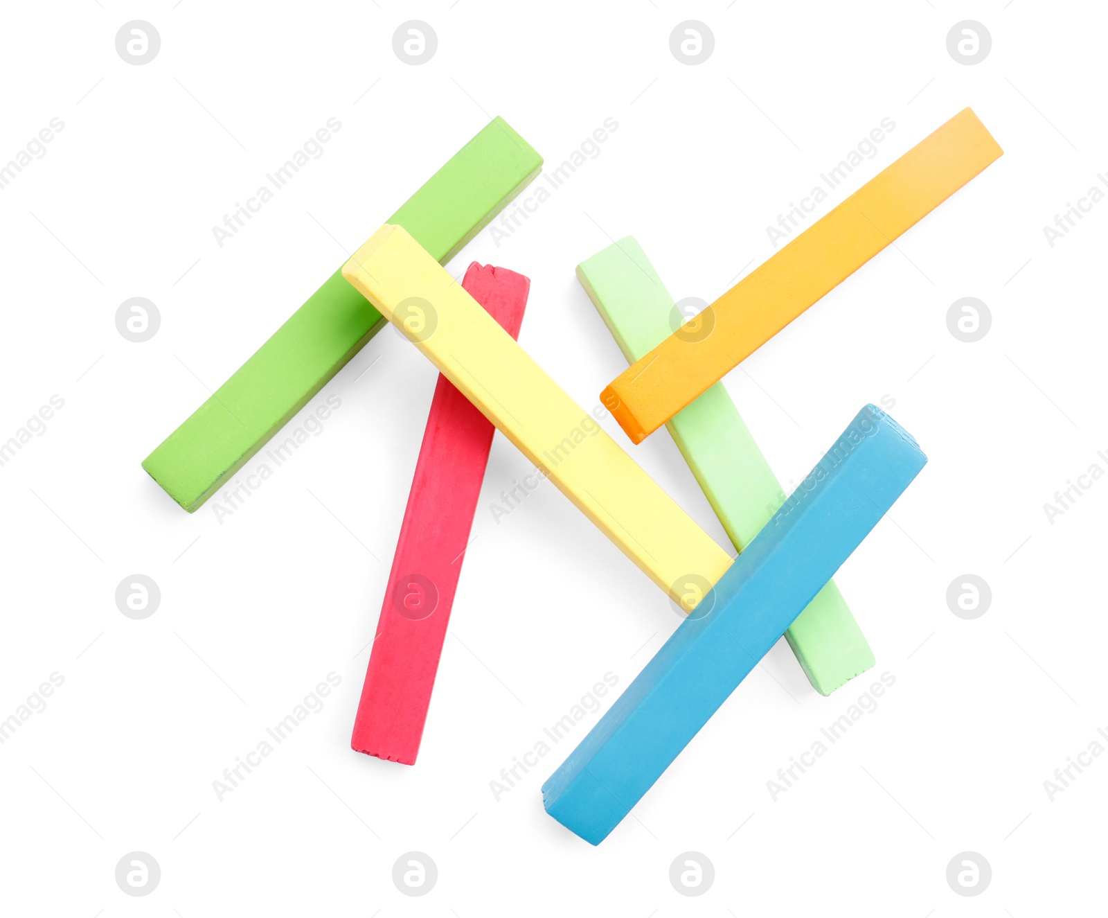 Photo of Colorful pastels on white background, top view. Drawing materials