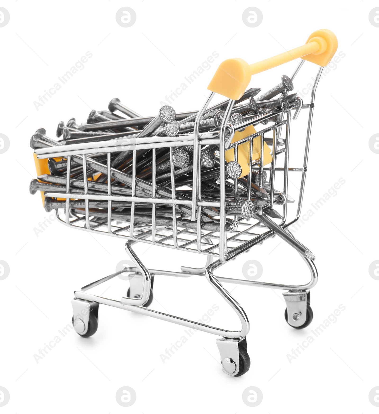 Photo of Metal nails in shopping cart isolated on white