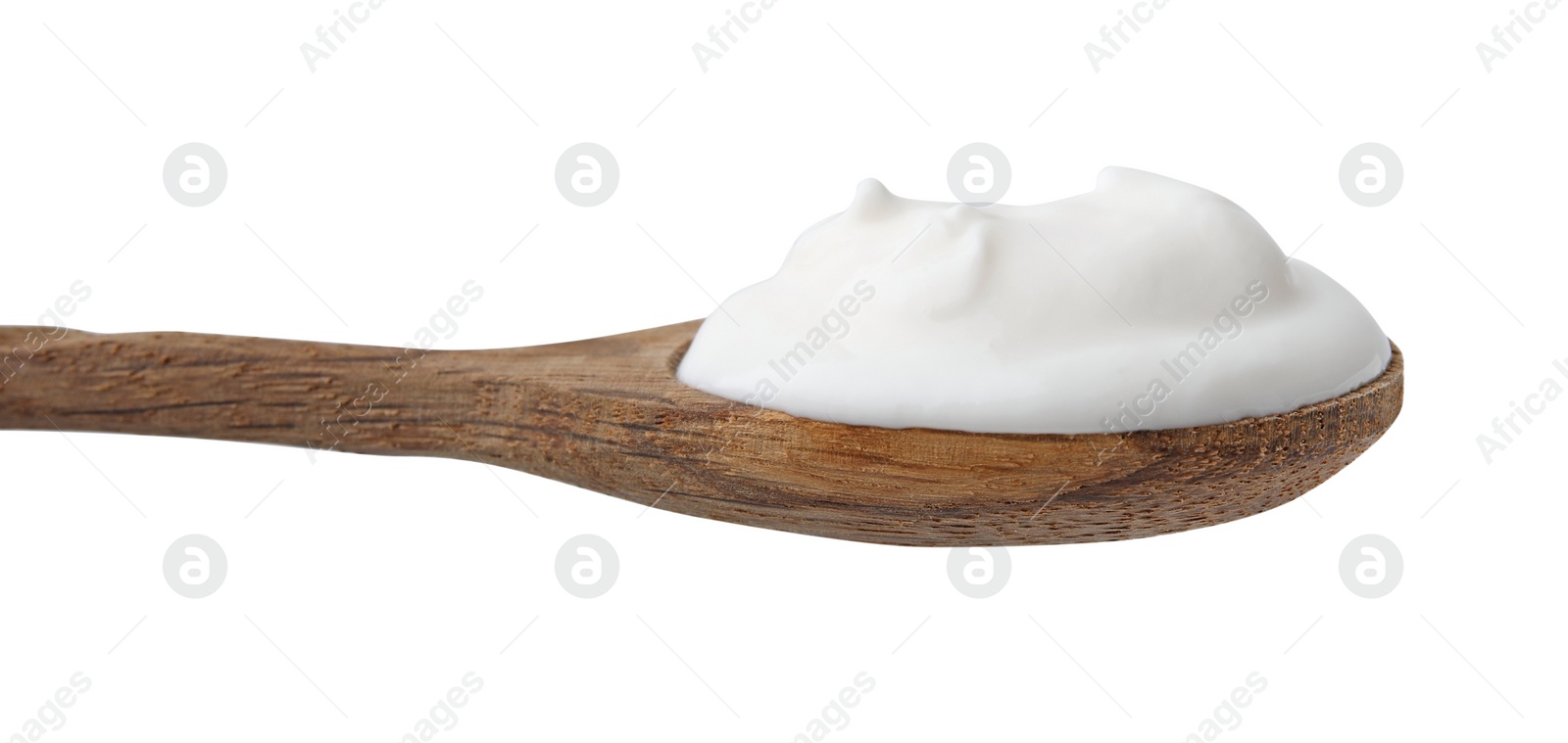 Photo of Delicious natural yogurt in spoon isolated on white