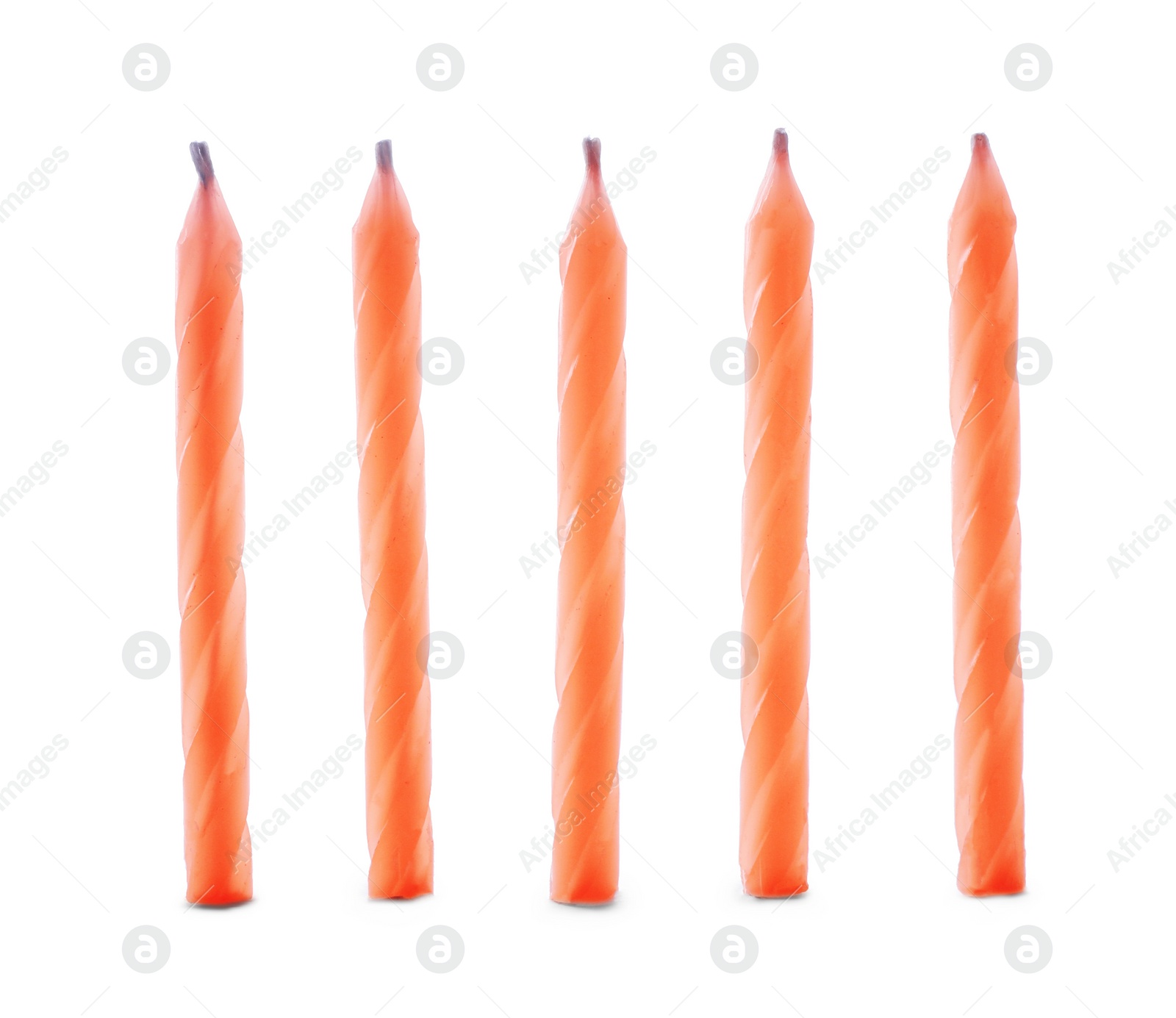 Photo of Thin orange birthday candles isolated on white