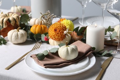 Photo of Beautiful autumn table setting. Plates, cutlery, glasses and floral decor