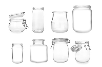 Set with different empty glass jars on white background