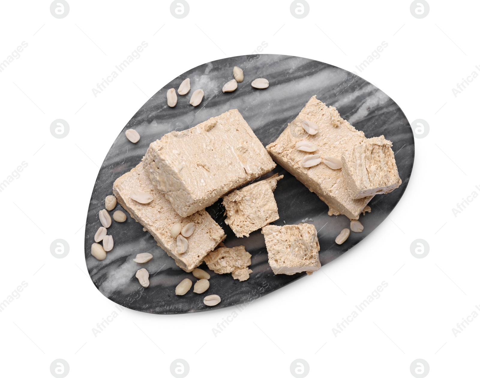 Photo of Pieces of tasty halva isolated on white, top view