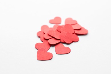 Photo of Pilepaper hearts on white background, closeup