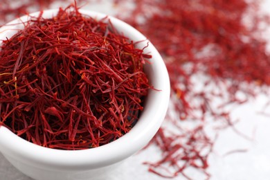 Dried saffron on grey table, closeup. Space for text