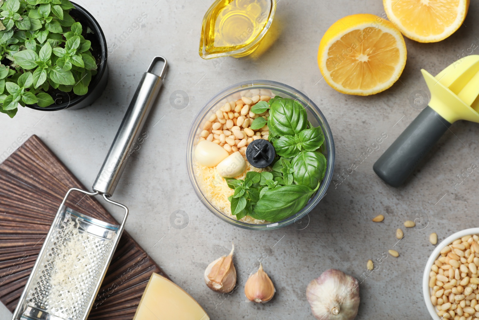 Photo of Flat lay composition with ingredients for homemade basil pesto sauce on table