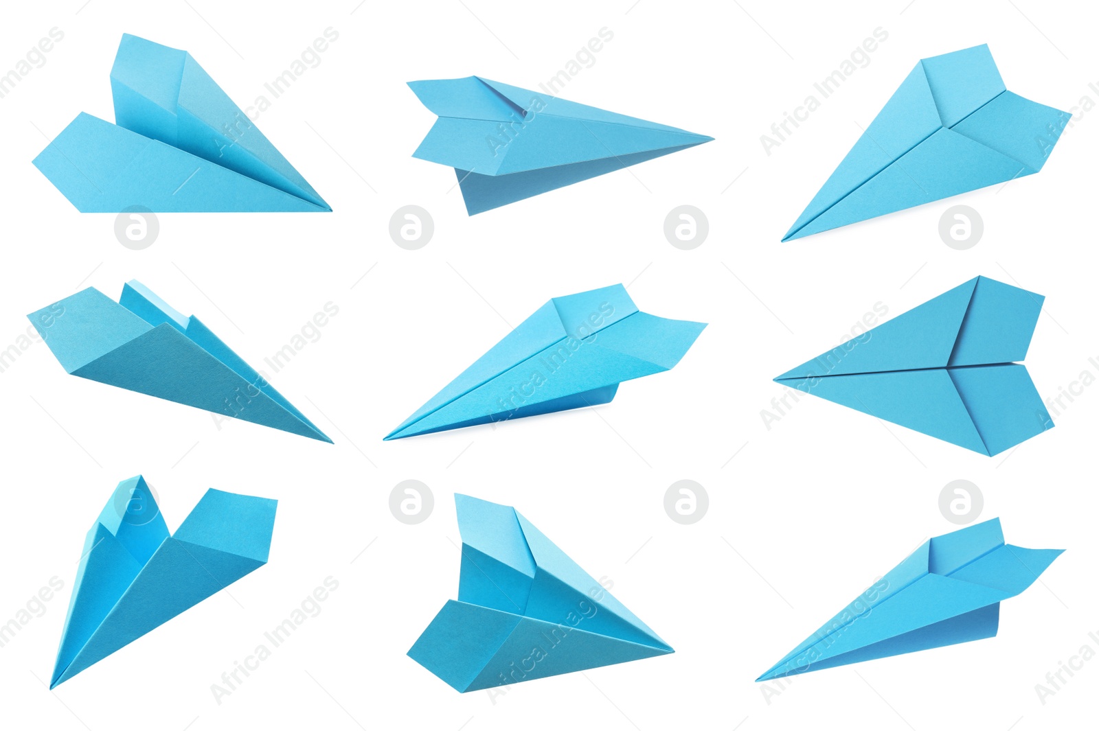 Image of Set with handmade light blue paper planes on white background