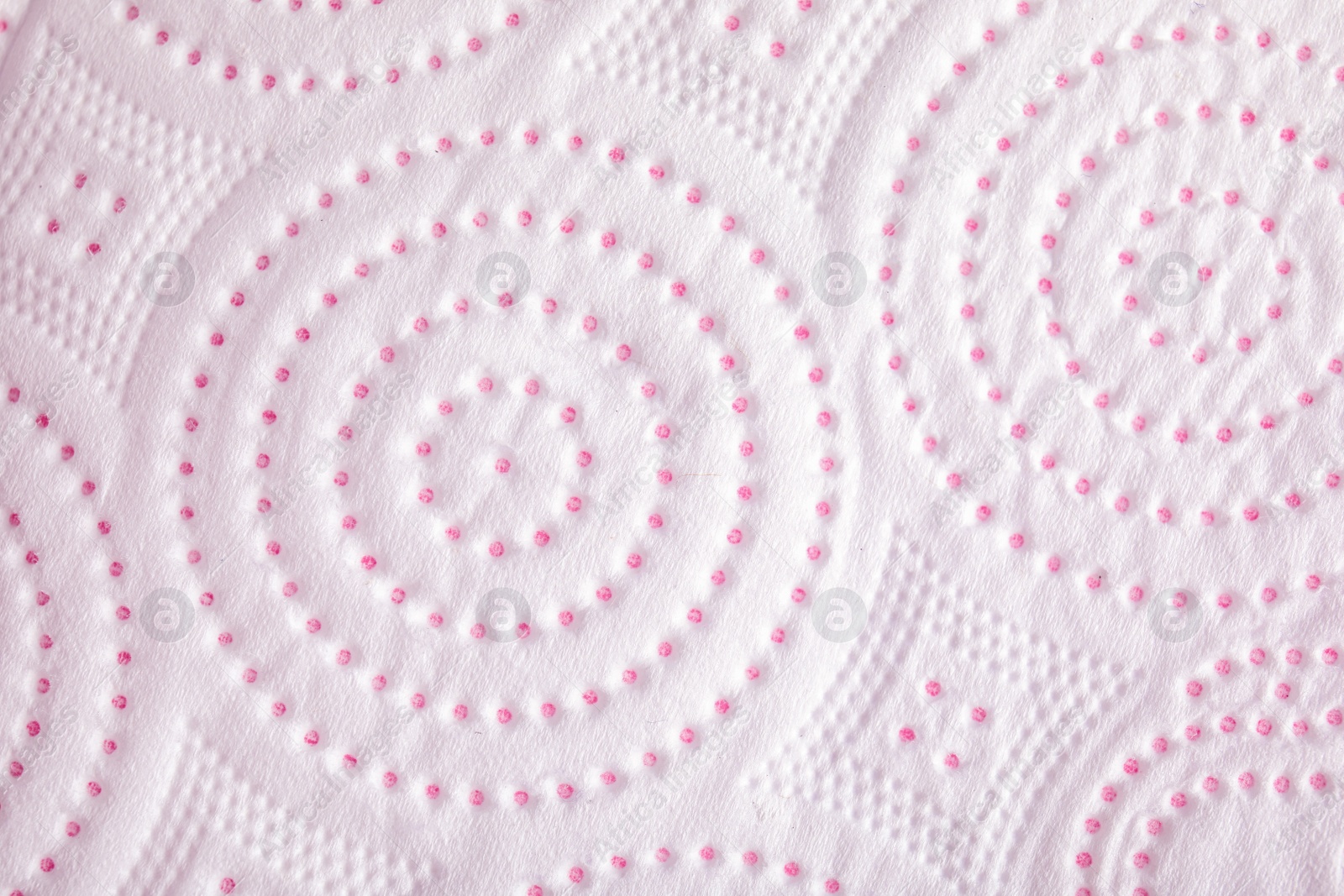 Photo of Toilet paper with pattern as background, closeup