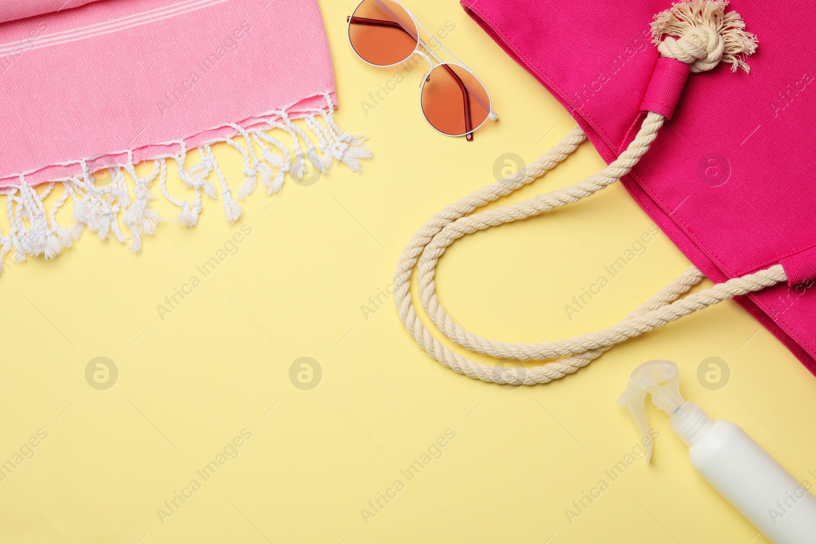 Photo of Flat lay composition with beach accessories and space for text on color background