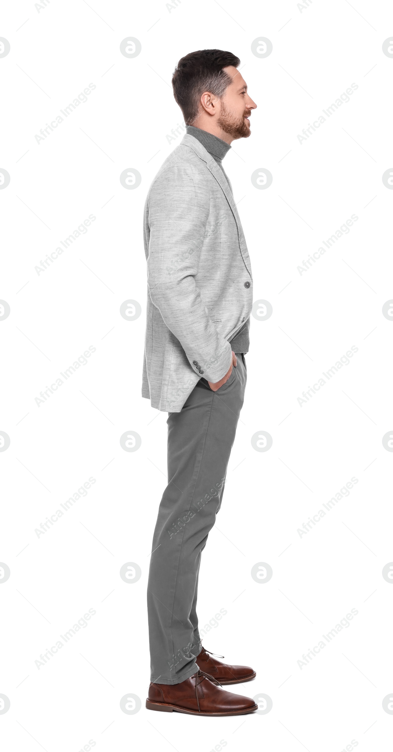 Photo of Handsome bearded businessman in suit on white background